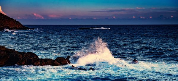 Scenic view of sea against sky during sunset