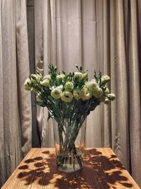 Close-up of flower vase on table