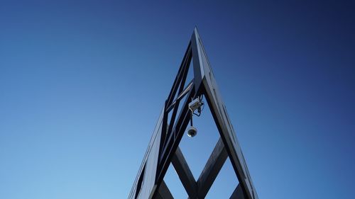 Low angle view of built structure against clear blue sky