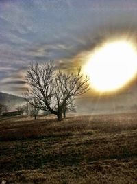 Scenic view of landscape against sky at sunset