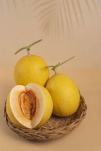 Close-up of fruits in basket on table