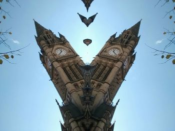 Low angle view of built structure against clear blue sky