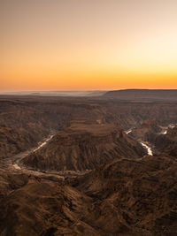 Scenic view of landscape against sky during sunset