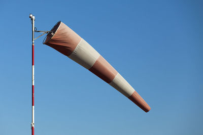 Close-up of an airfield windsock in moderate winds.