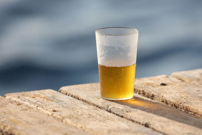 Close-up of beer glass on table