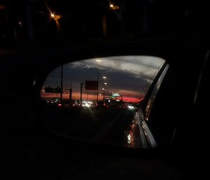 Cars on road seen through window at night