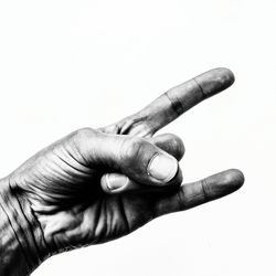 Close-up of man hand against white background