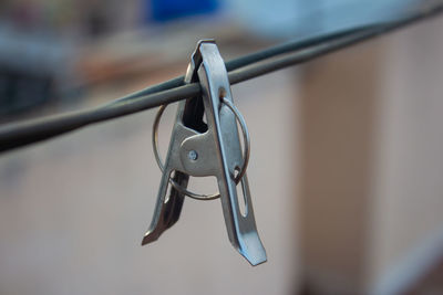 Close-up of padlocks hanging on rope