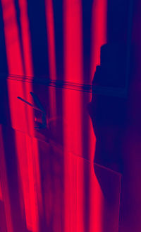 Close-up of red light painting on wall