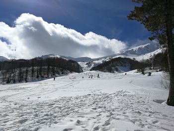 Scenic view of snowcapped mountains against sky