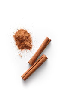 High angle view of bread on table against white background