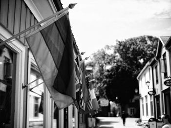 Low angle view of flags hanging from building