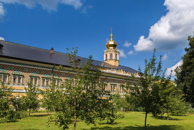 View of temple building against cloudy sky