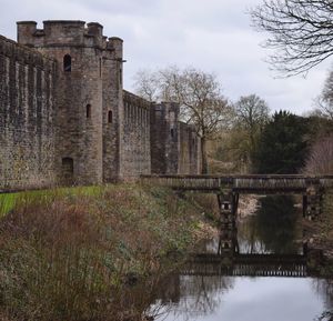 Bridge over river with buildings in background