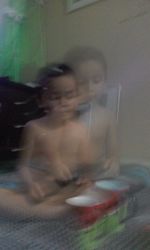 Blurred motion of woman sitting at camera