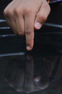 Close-up of person holding hands