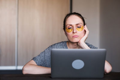 Portrait of woman using mobile phone