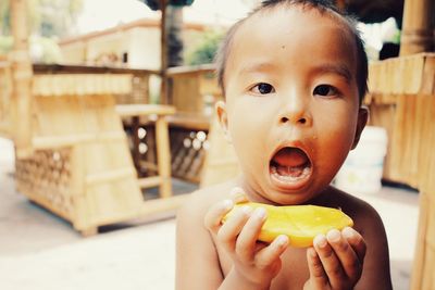 Close-up of toddler eating