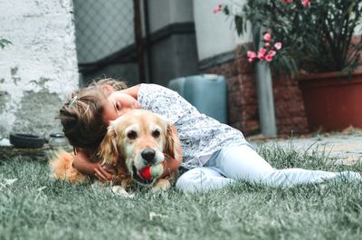 Portrait of dog relaxing on grass