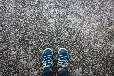 Low section of person standing on street