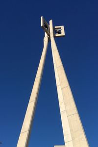 Low angle view of cross against clear blue sky