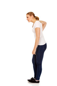 Side view of a young woman against white background