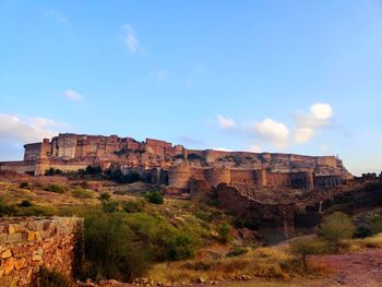 Rock formations on landscape against sky