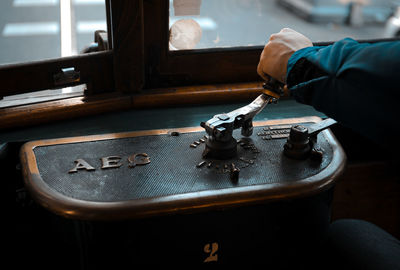 Close-up of man driving a tram