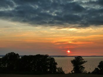 Scenic view of sea against cloudy sky