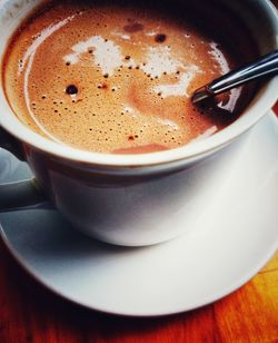 Close-up of coffee cup on table