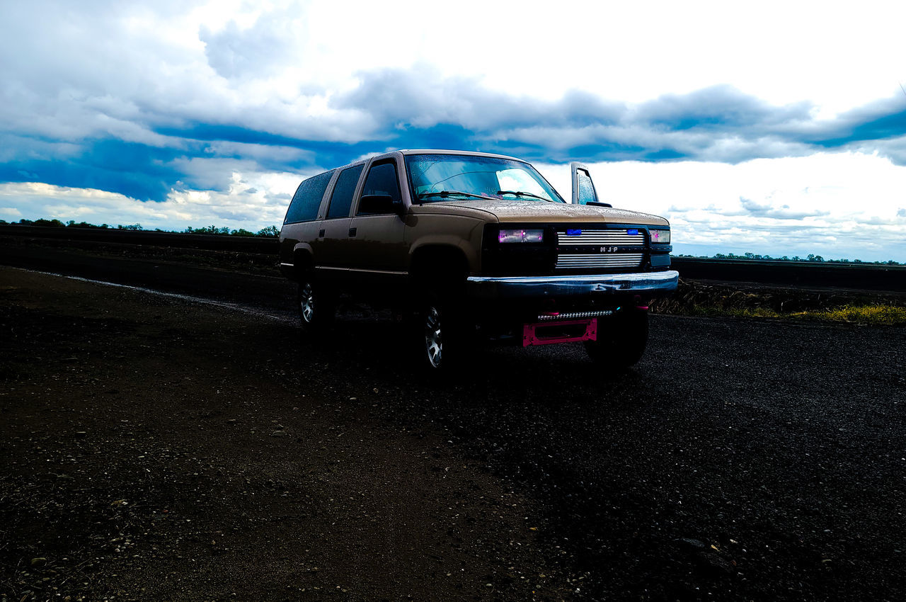 transportation, mode of transportation, motor vehicle, car, cloud, sky, road, vehicle, land vehicle, nature, landscape, environment, travel, motion, land, no people, journey, outdoors, off-roading, non-urban scene