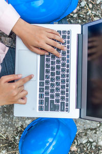 Man using laptop outdoors