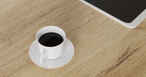 High angle view of coffee cup on table