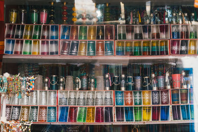 Multi colored candies in shelf at store