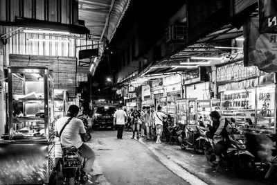 People on street in city at night