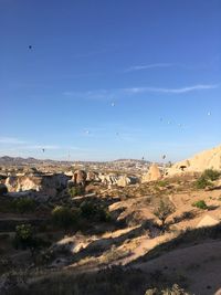 Scenic view of landscape against blue sky