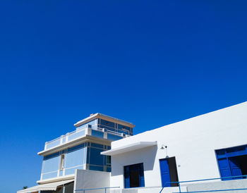 Low angle view of building against clear blue sky