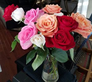 Close-up of roses in vase on table