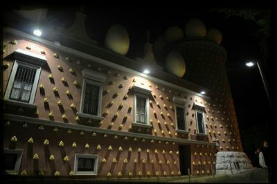 Low angle view of illuminated building at night