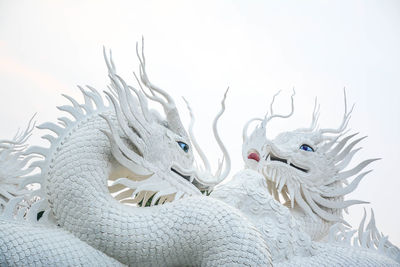 White chinese dragon decorated on a chinese dragon sculpture design background