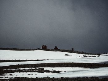 Scenic view of snow covered landscape against sky