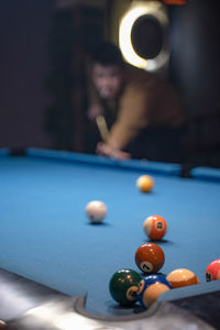 Cropped hand playing pool