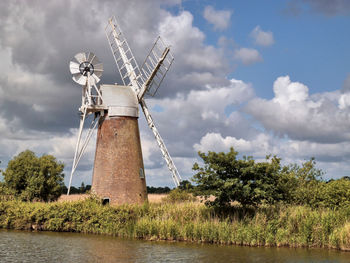 Traditional windmill against sky