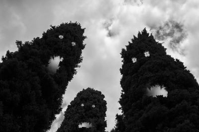 Low angle view of old building against cloudy sky