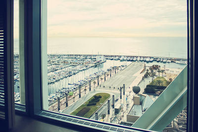 High angle view of cityscape seen through window