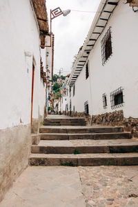 Footpath amidst buildings in town