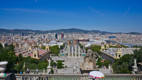 High angle view of townscape against blue sky