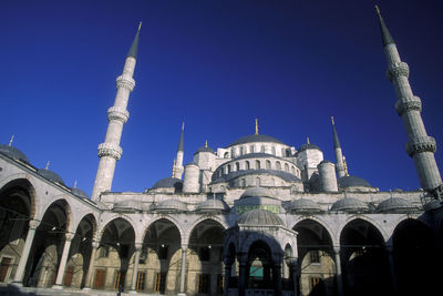 Low angle view of building against blue sky