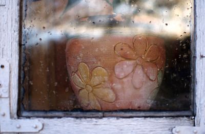 Close-up of heart shape on glass window