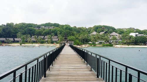 Narrow walkway leading to bridge